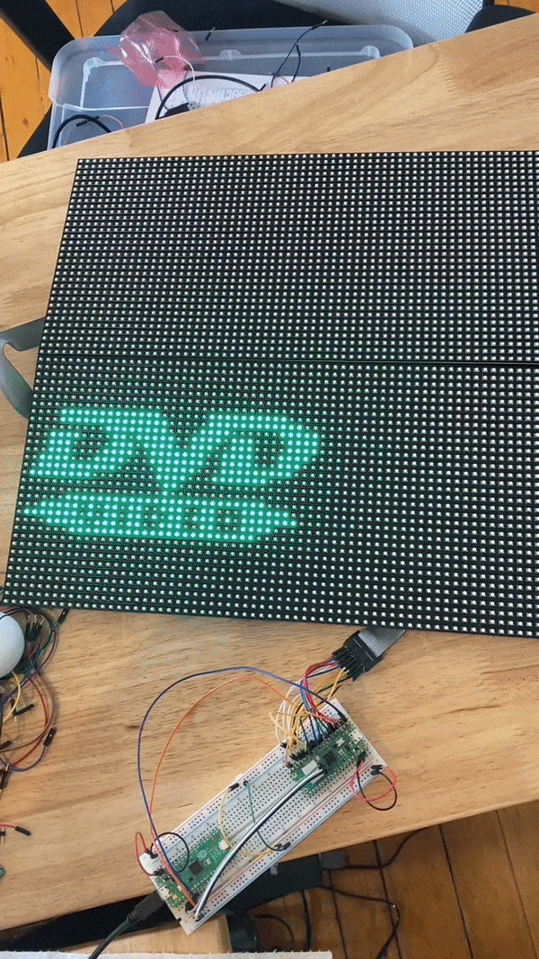 GIF of bouncing color-changing DVD logo animation across 2 Adafruit LED matrices